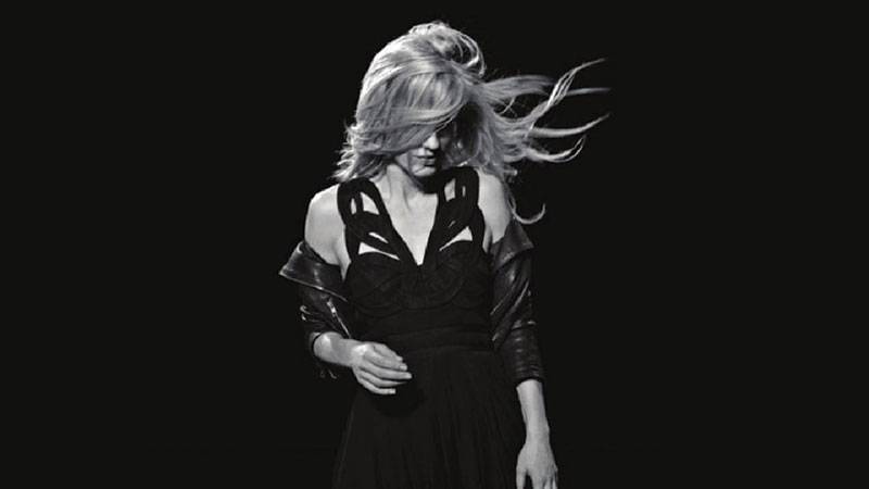 Model in black dress (REISS) with dark background