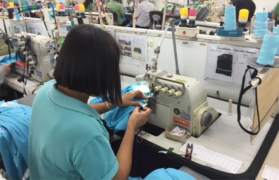 woman sewing in Nan Yang Textile group