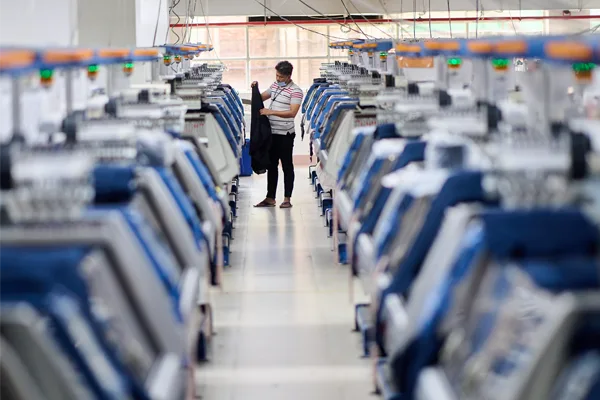 Leading Knitwear Manufacturer, SQ Celsius's showroom with garments hanging.