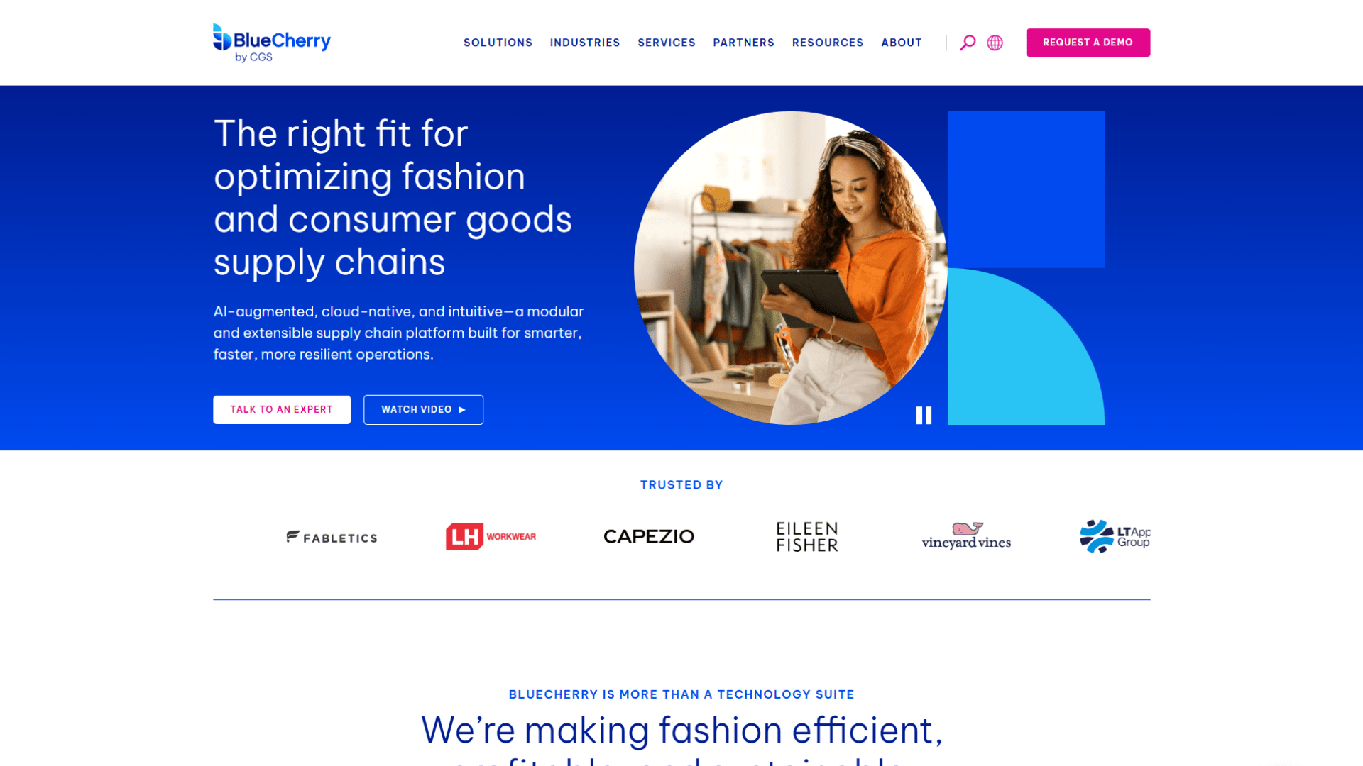 BlueCherry fashion supply chain platform webpage featuring a woman using a tablet in a clothing workspace, with messaging about optimizing fashion and consumer goods supply chains.